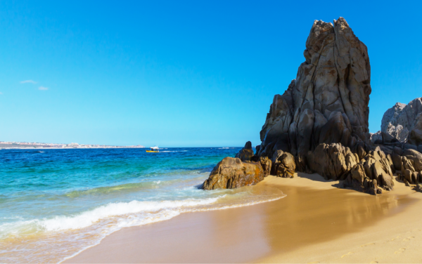 La Paz beach with tall rock outcropping