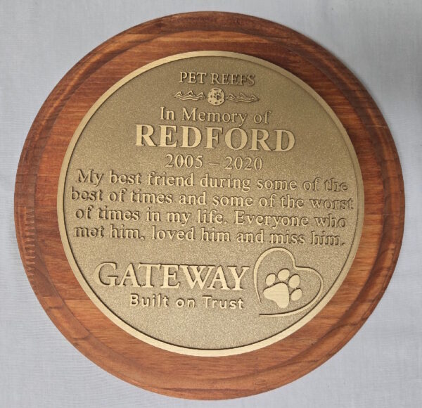 wood-mounted bronze plaque example